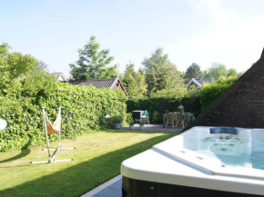 Отель Cosy Holiday Home in Lauwersoog by the Lake with jacuzzi  Лауверсвог
